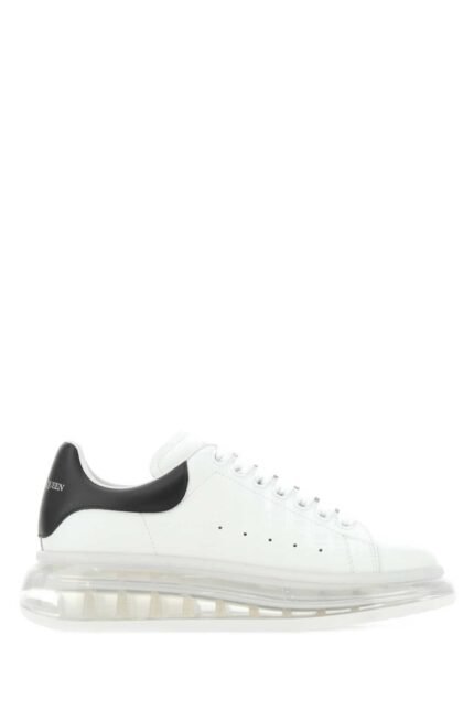 White leather sneakers with black heel