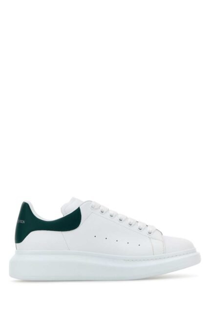 White leather sneakers with dark green leather heel